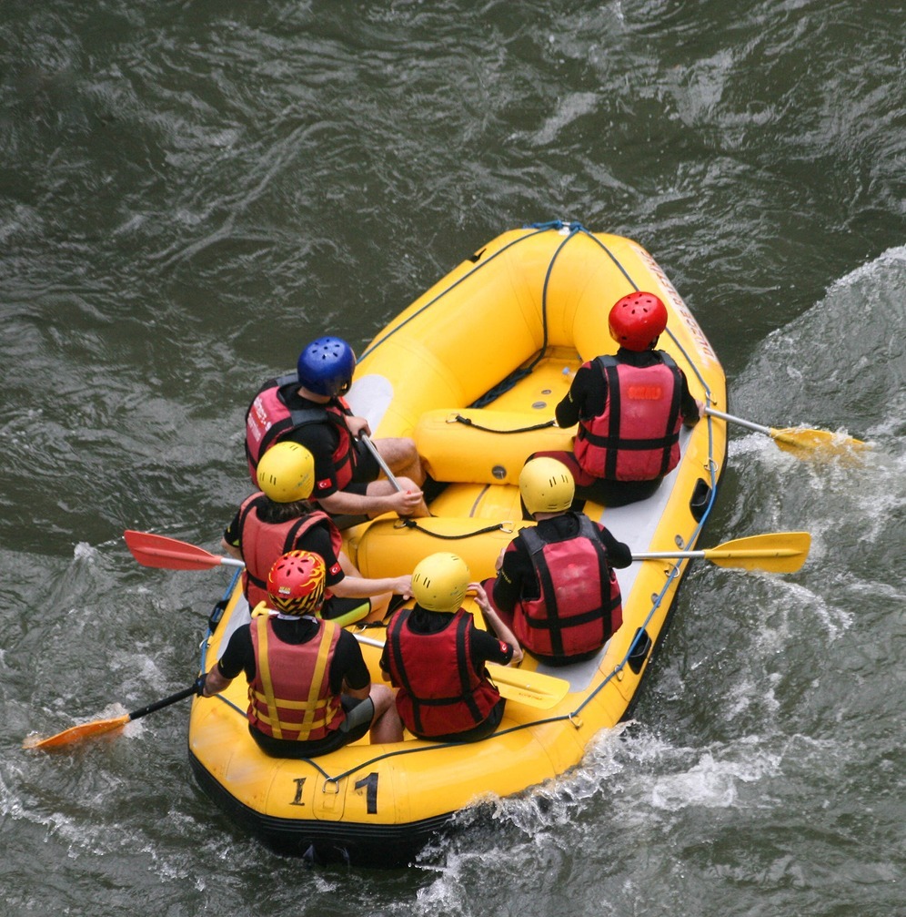 Rafting… Group Of People Whitewater Rafting On A River